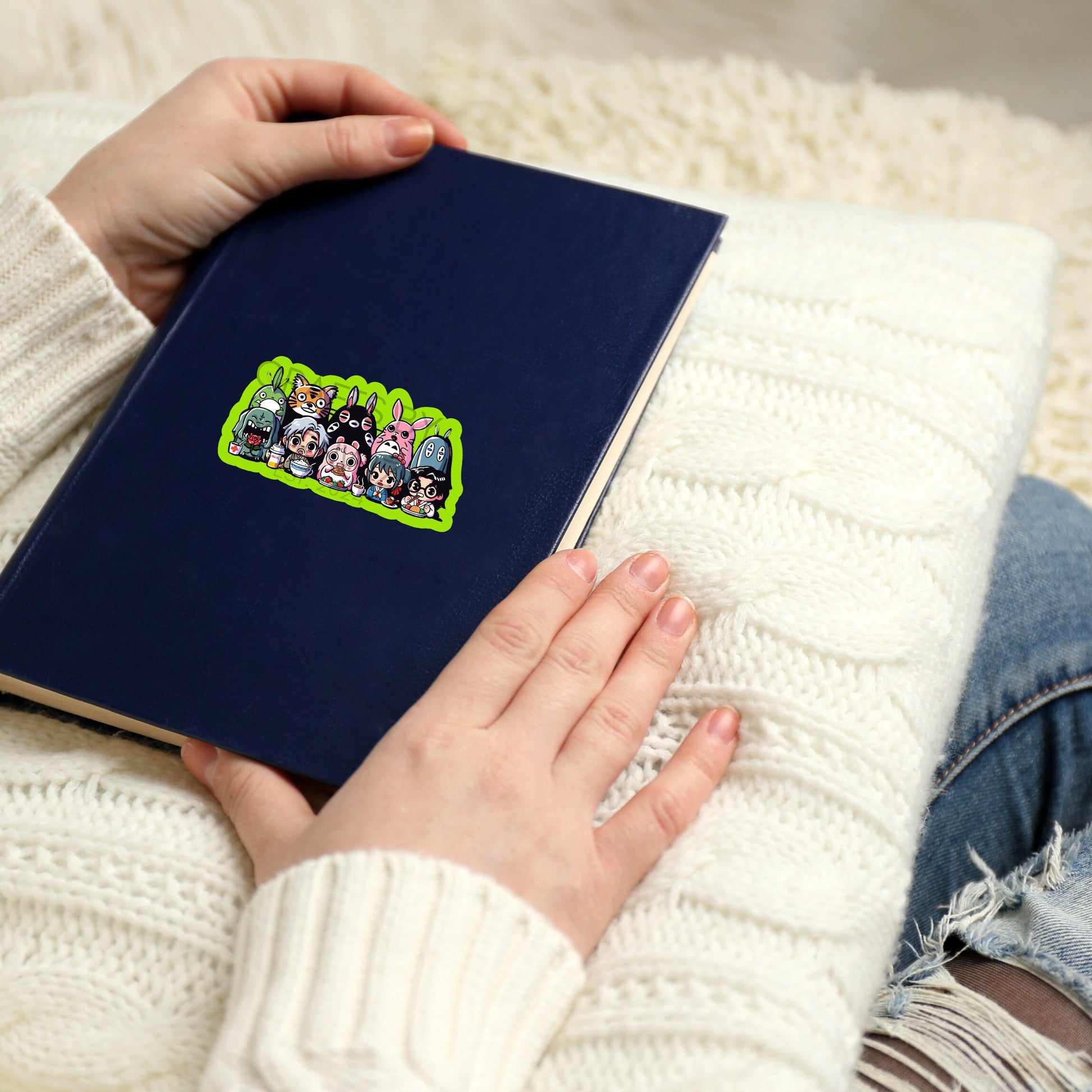 a person sitting on a couch holding a book