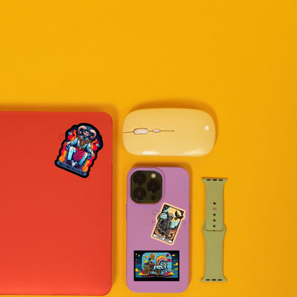 a cell phone, mouse, and other items on a yellow surface