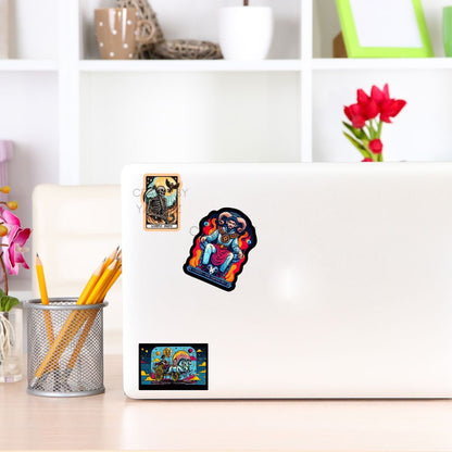 a laptop with stickers on it sitting on a desk