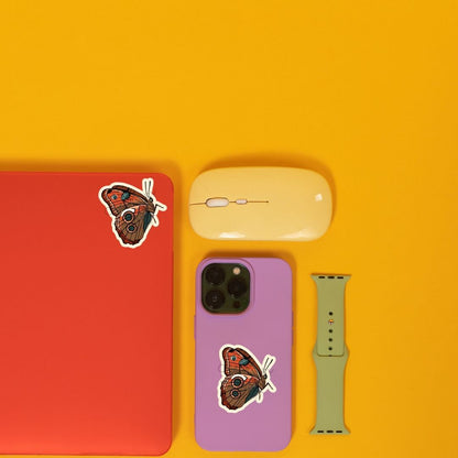 a cell phone, mouse, and other items on a yellow surface