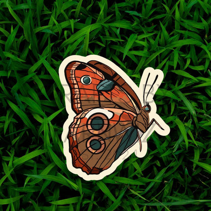 a sticker of a butterfly on some grass