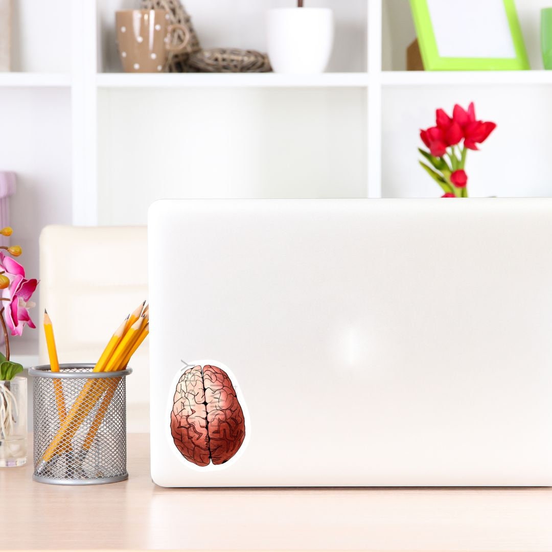 a laptop with a brain sticker on it