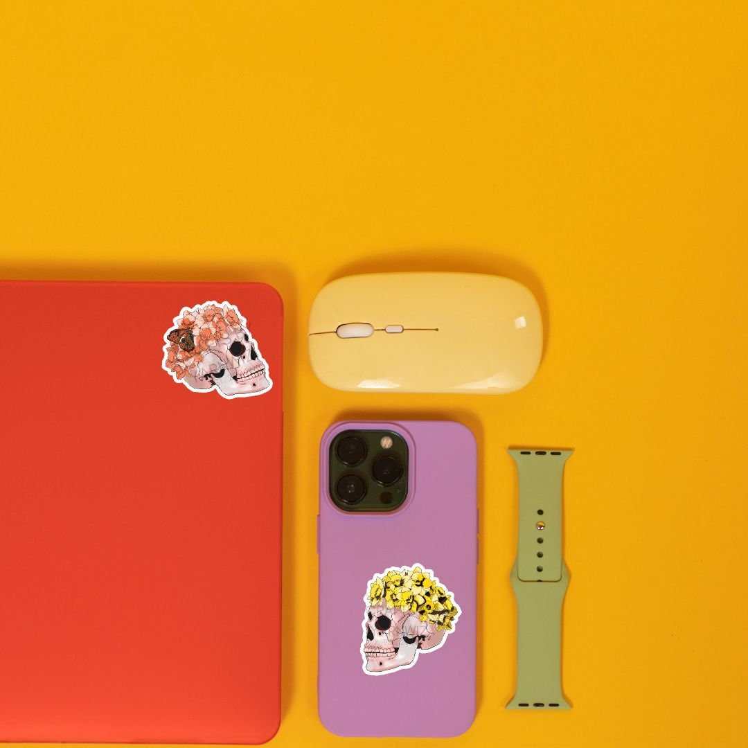 a cell phone, mouse, and other items on a yellow surface