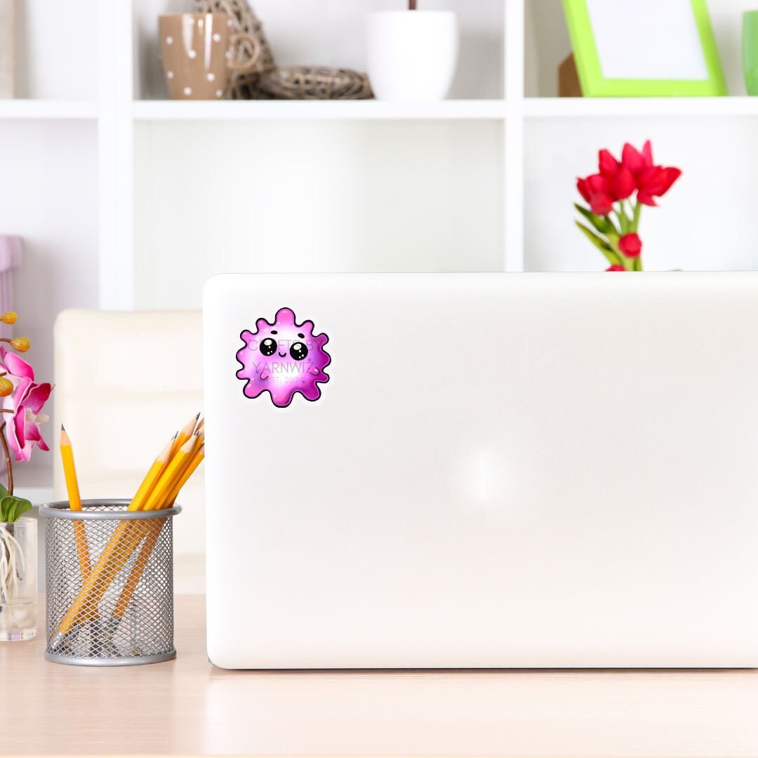 a laptop computer sitting on top of a wooden desk