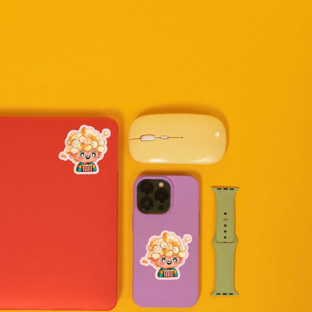 a cell phone, mouse, and other items on a yellow surface