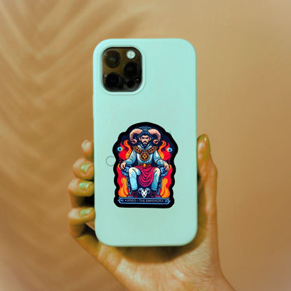 a person holding a phone with a sticker on it