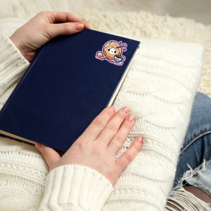 a person is holding a book in their hand