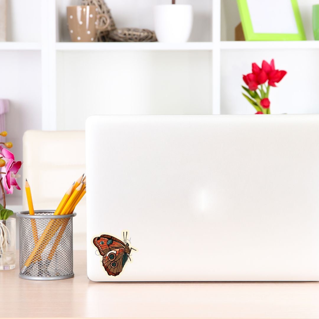 a laptop computer sitting on top of a wooden desk