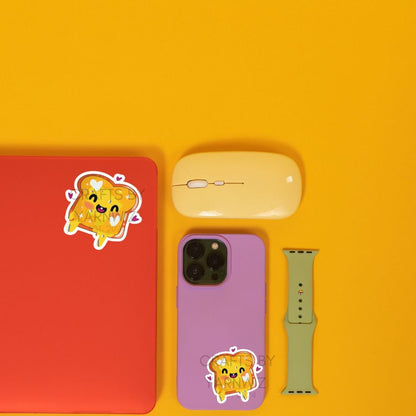 a cell phone, mouse, and other items on a yellow surface