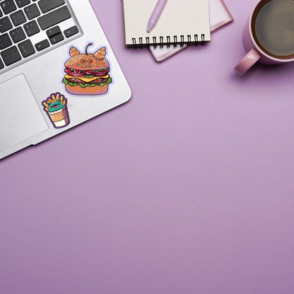 a laptop computer sitting on top of a desk next to a cup of coffee