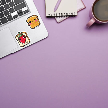 a laptop computer sitting on top of a desk next to a cup of coffee