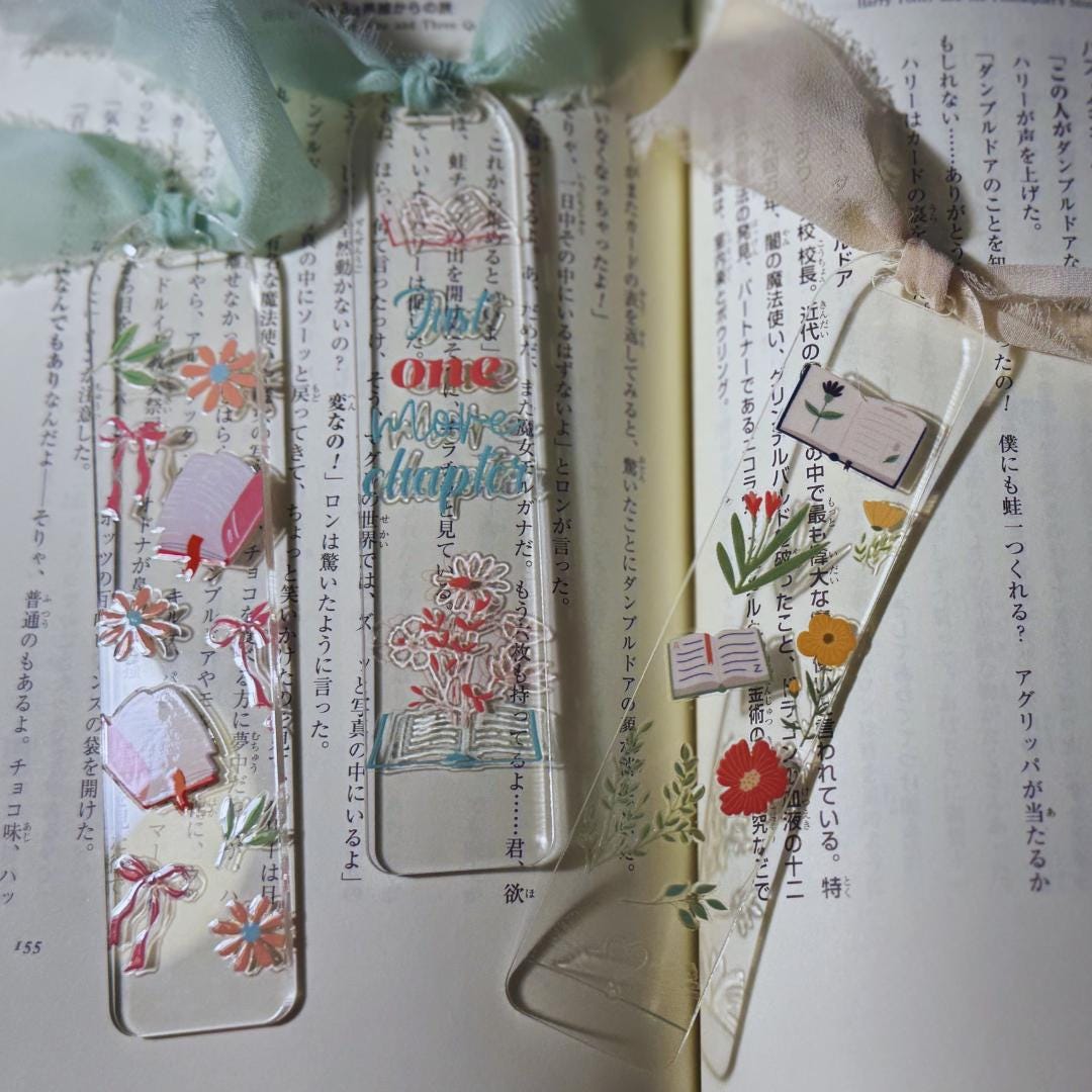 a bookmark with a bow on top of it