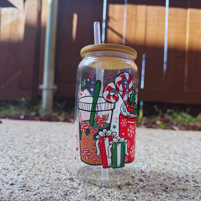 a glass jar with candy canes and candy canes on it