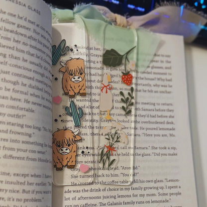 an open book with stickers on it