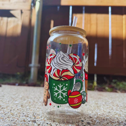 a glass jar with a picture of a santa clause on it