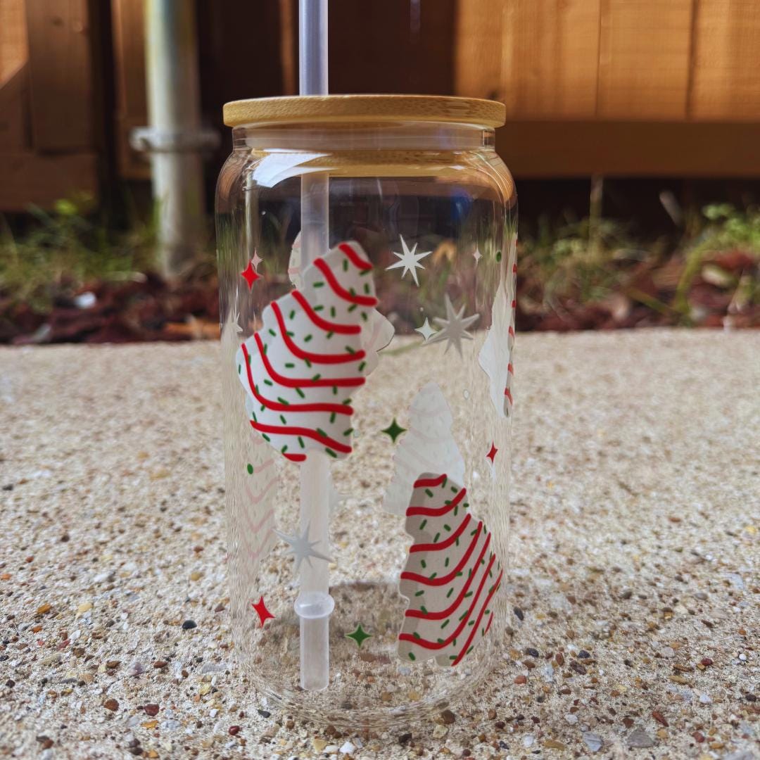 a glass jar with some decorations inside of it