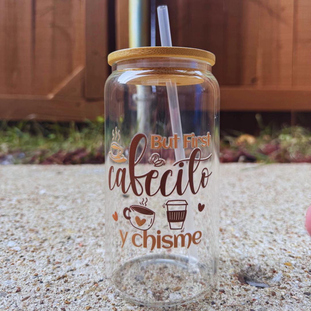 a glass with a straw in it sitting on a counter